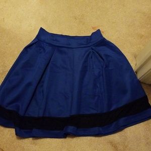 Blue, flowy skirt.